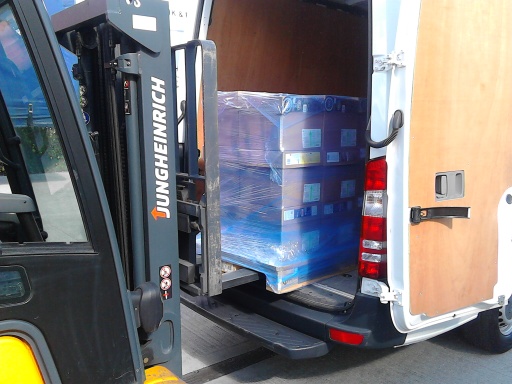 Loading pallets into MSP Logistics van with forklift